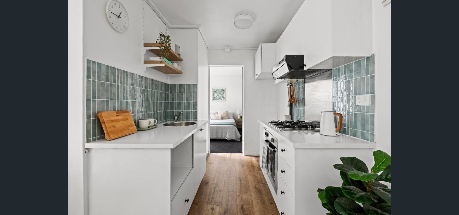 Draft House kitchen before renovation — original galley layout with green tile